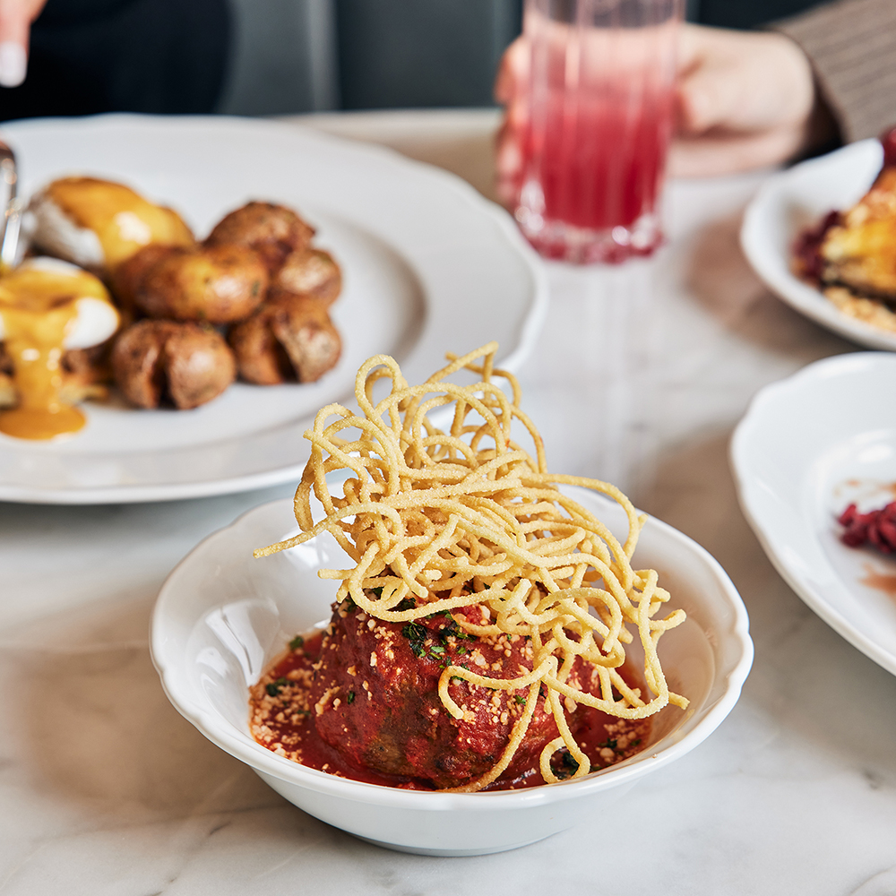 An Italian staple, the Big Meatball is a highlight of weekend brunch and is topped with fried spaghetti.